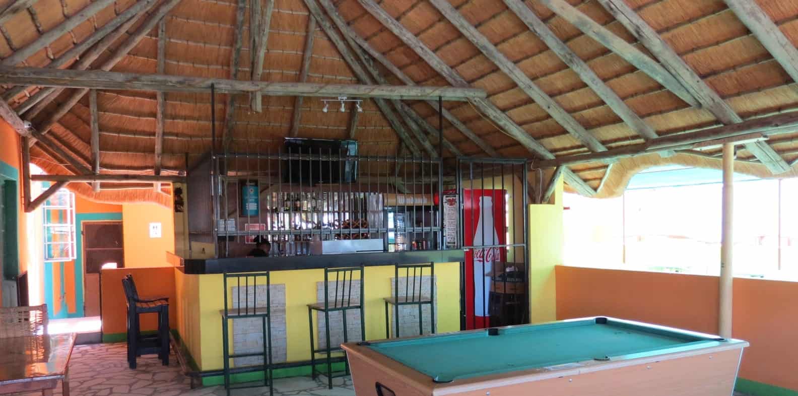 Bar counter and pool table under thatch