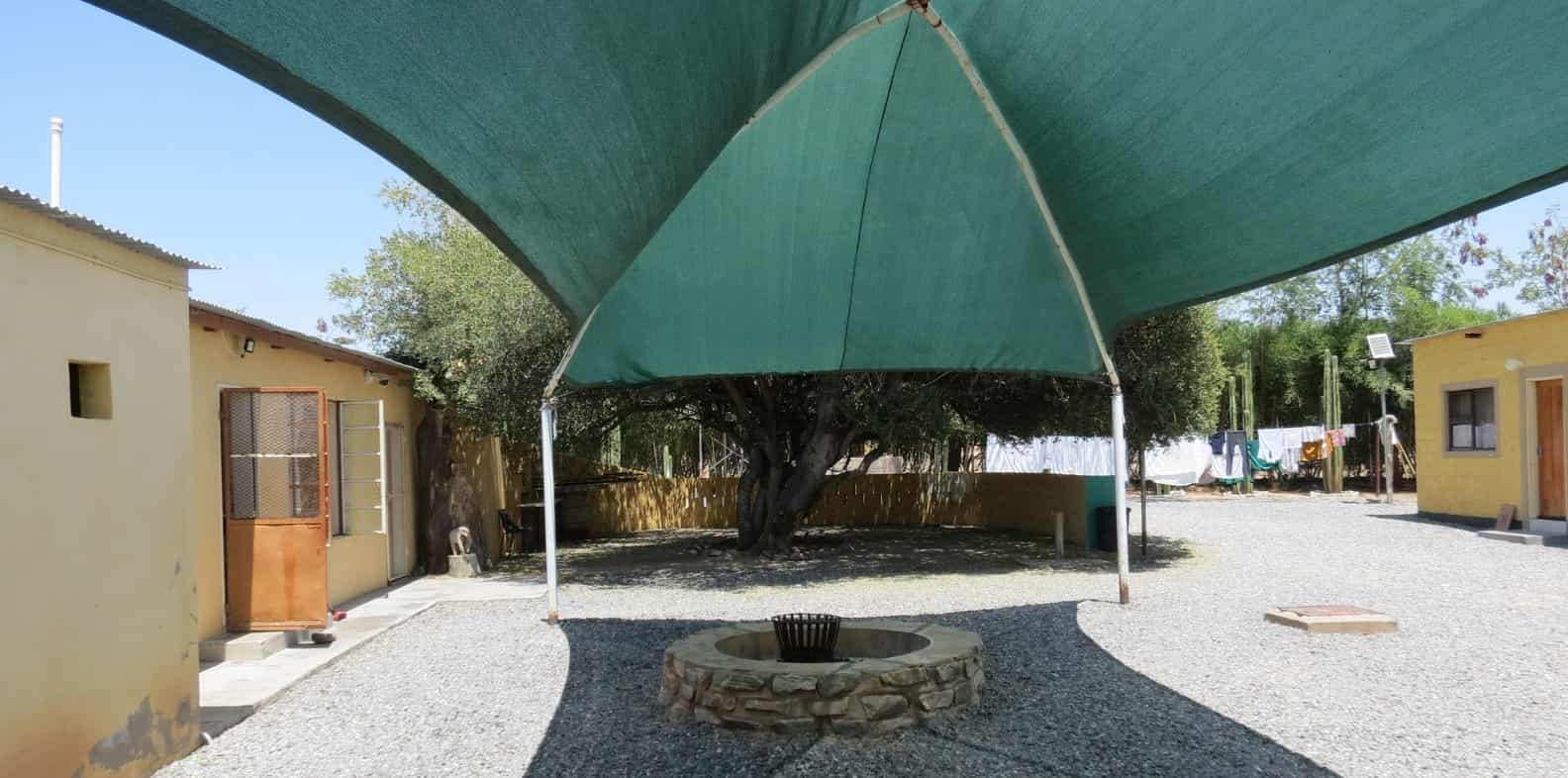 Braai fireplace under the green shade sail