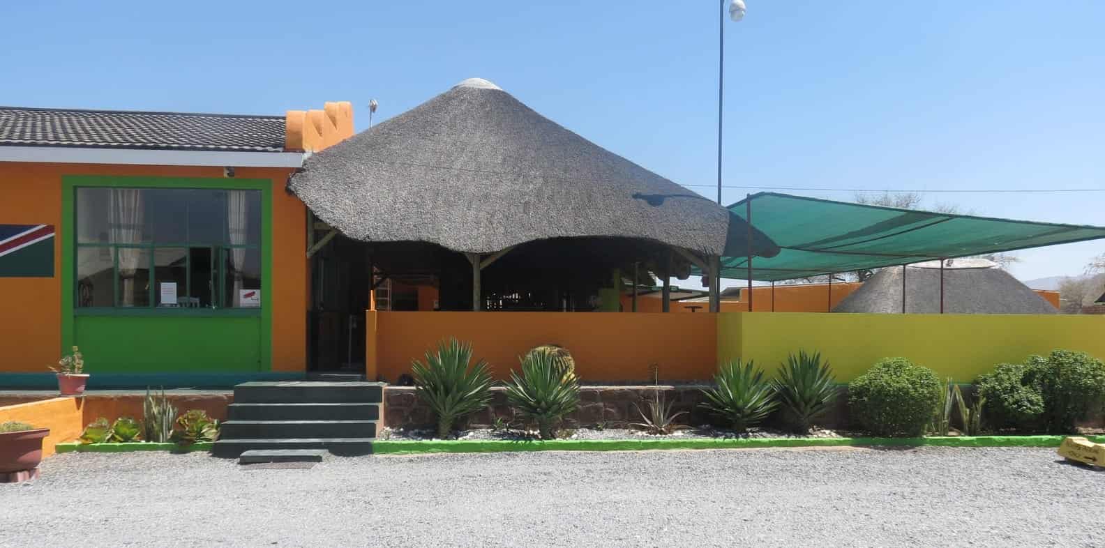 Yellow building with its thatched lapa roof