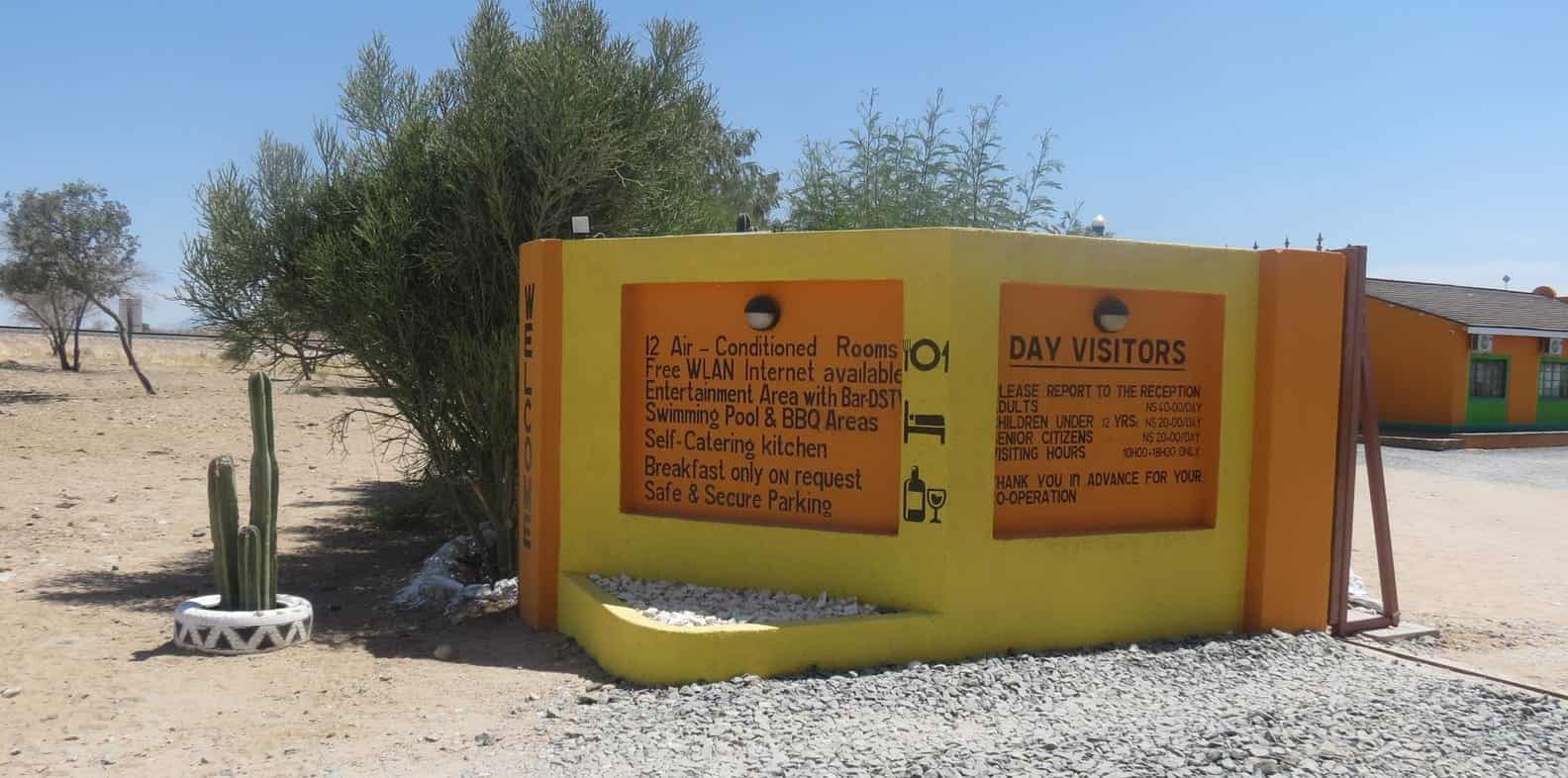 Day visitors welcome board at the entrance