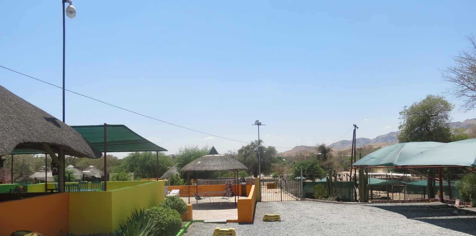 Thatched lapa and shade sails over the pool