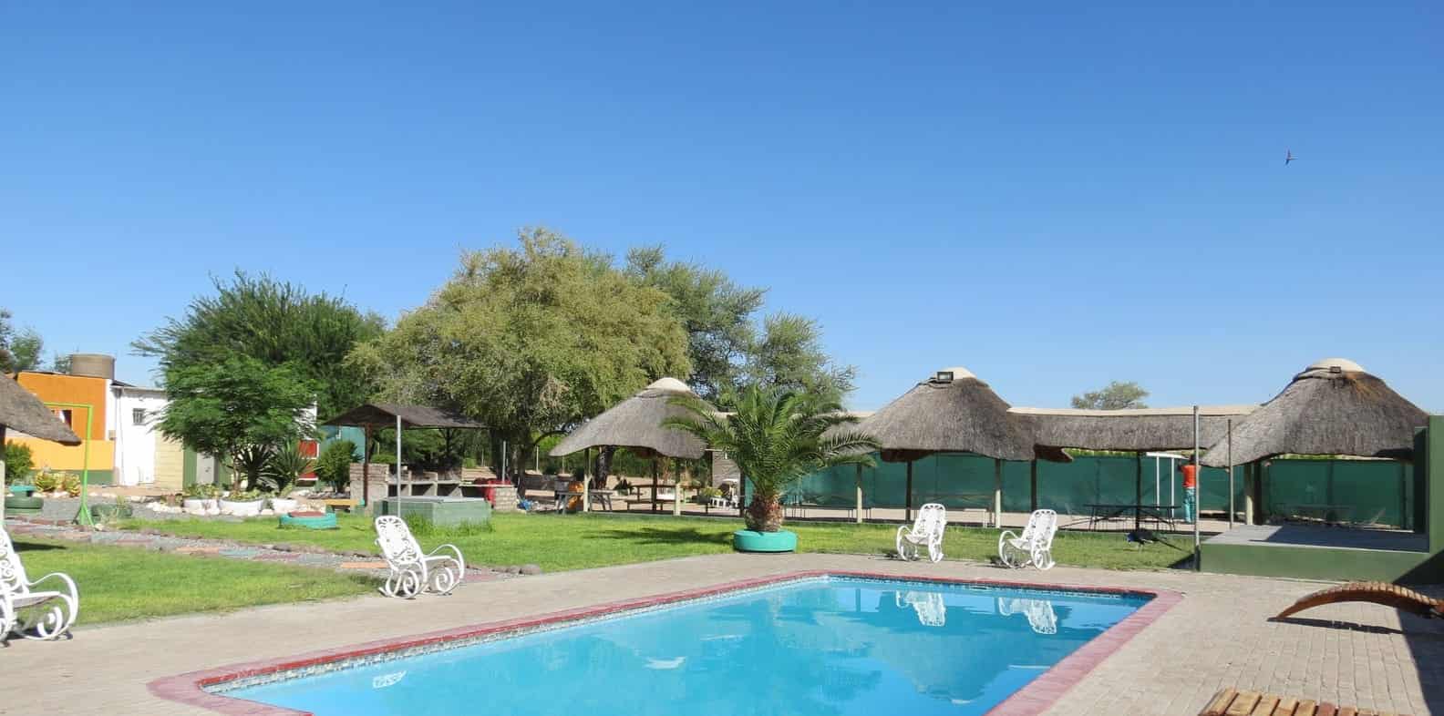 Pool and garden with shade umbrellas