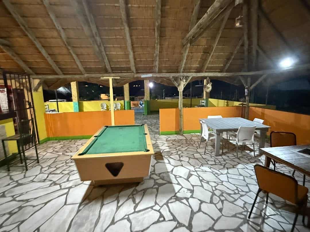 Pool table area on the stone floor at night