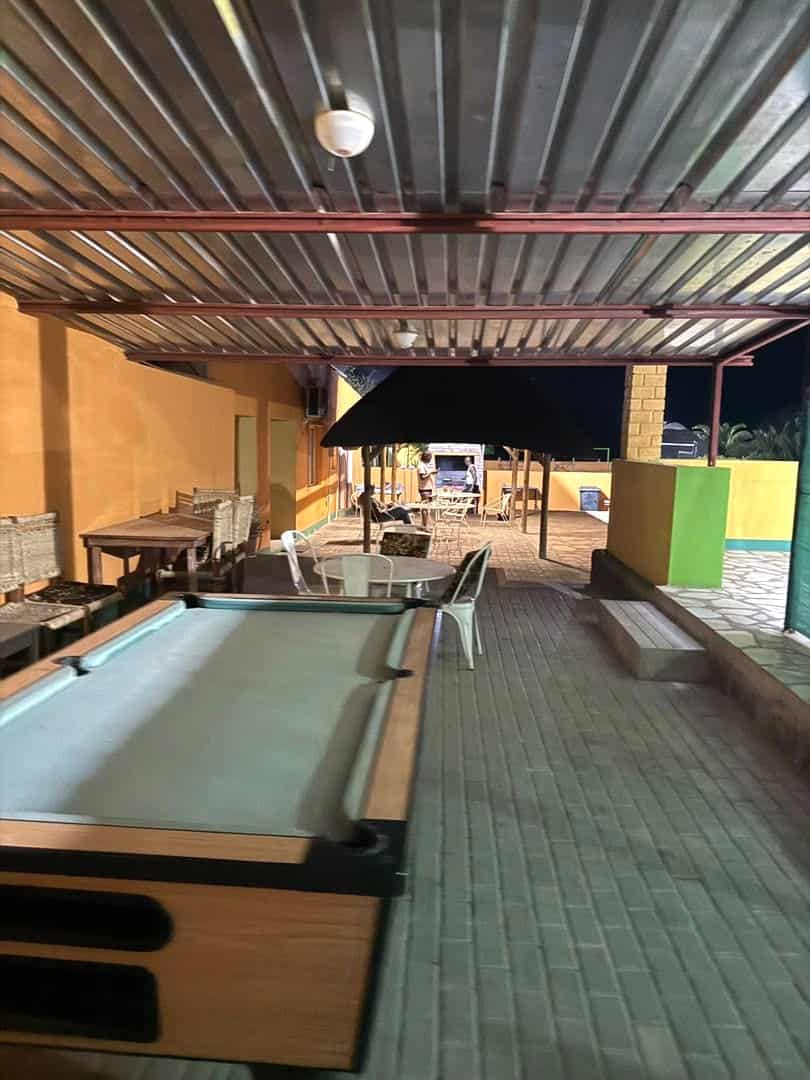 Pool table and terrace under the roof at night