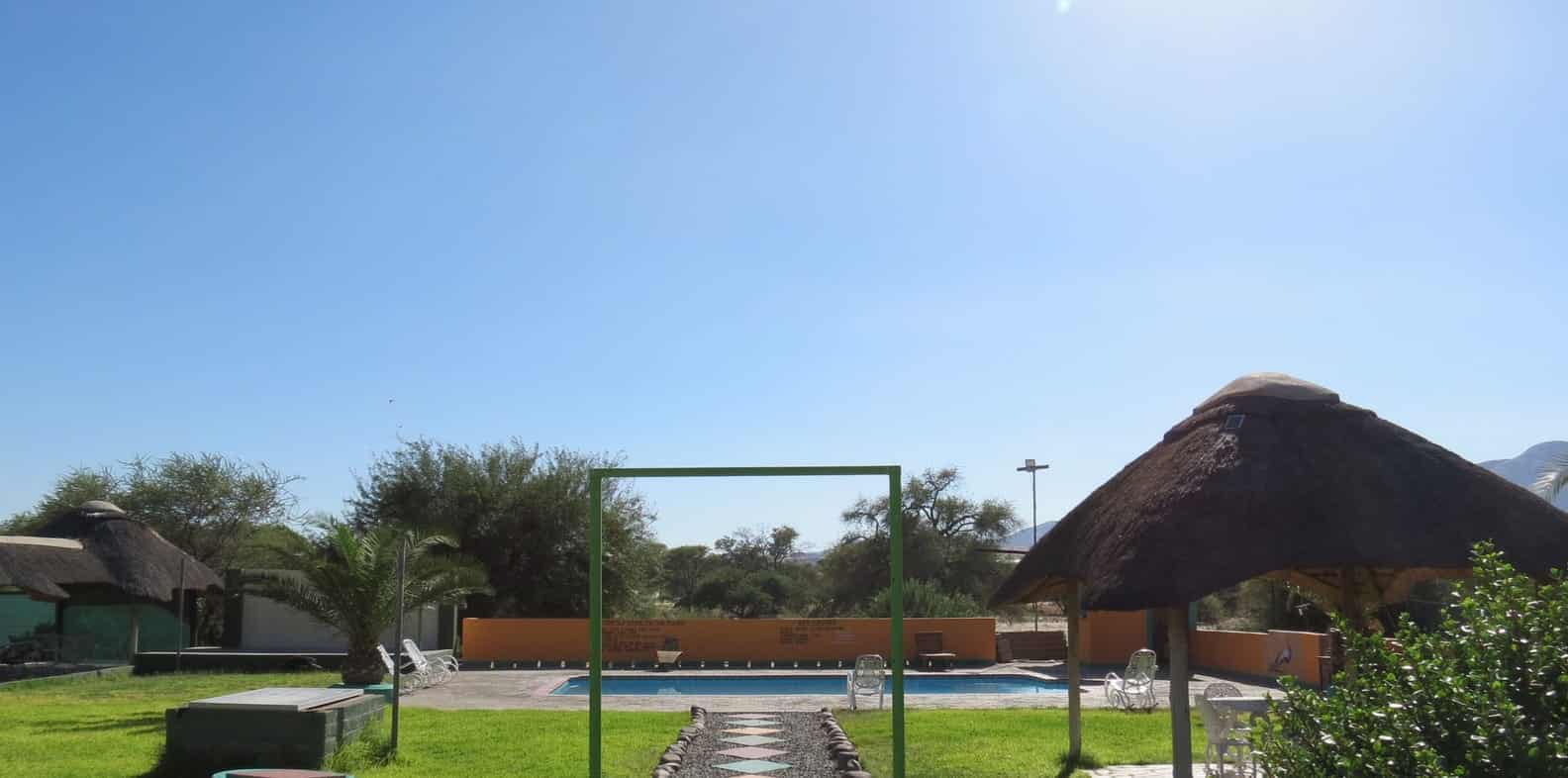 Pool with loungers under the trees