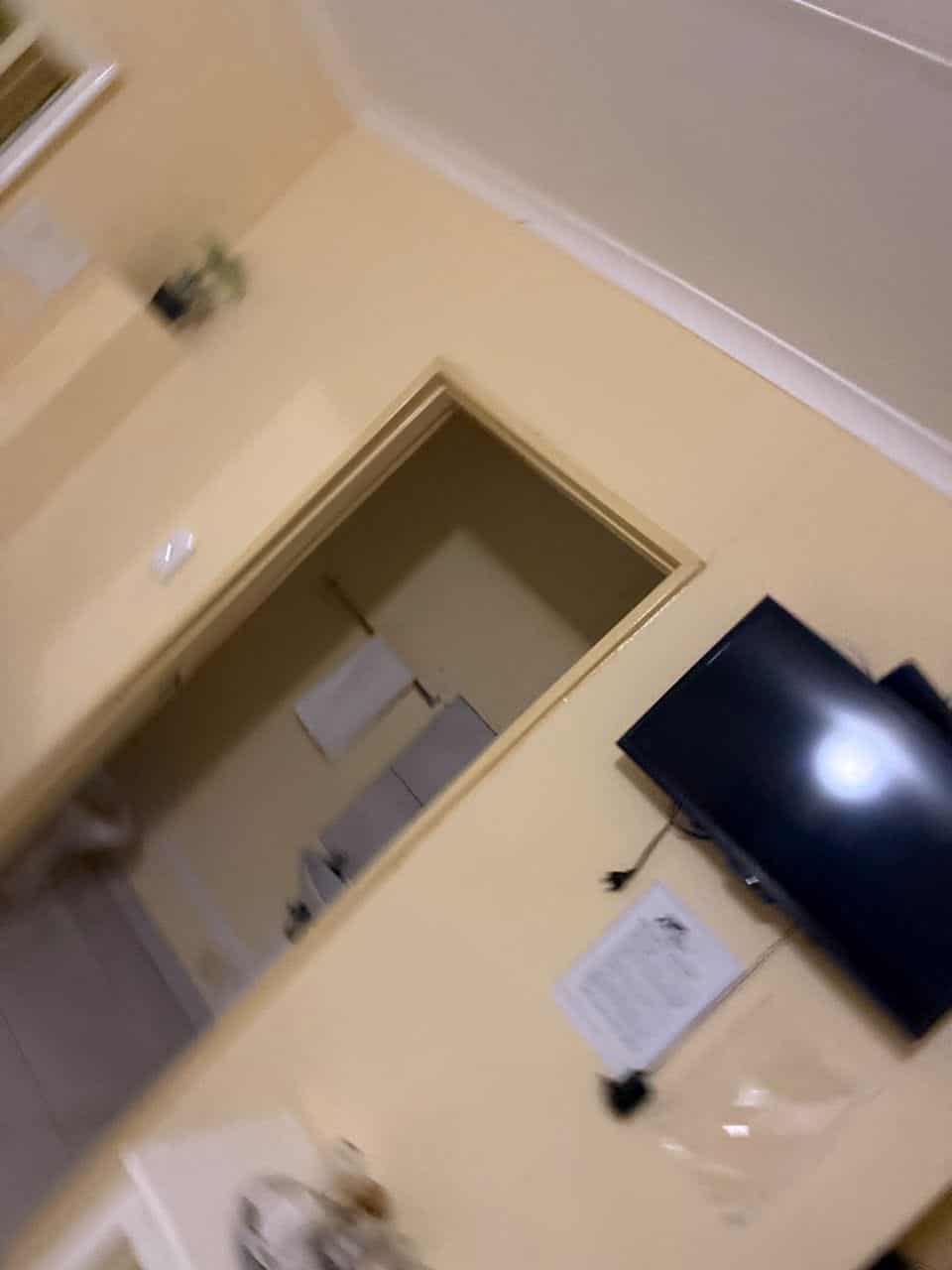 Room corner with television, kettle and en suite door