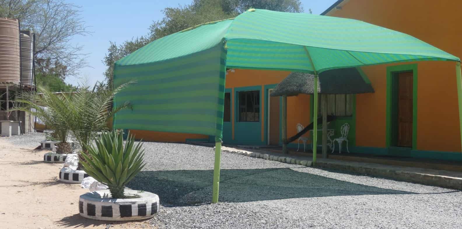 Green shade sail over the firepit courtyard