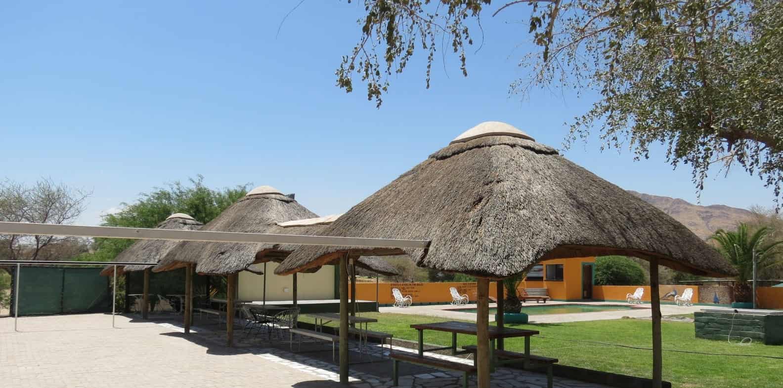 Row of thatched umbrellas on the lawn