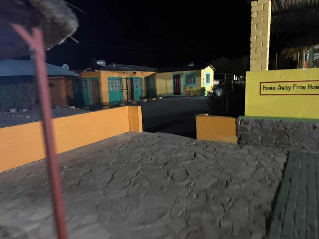 Walkway to the rooms after dark