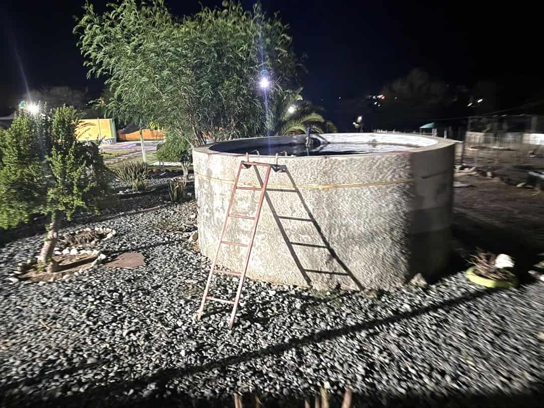 Stone water tank under the night lights