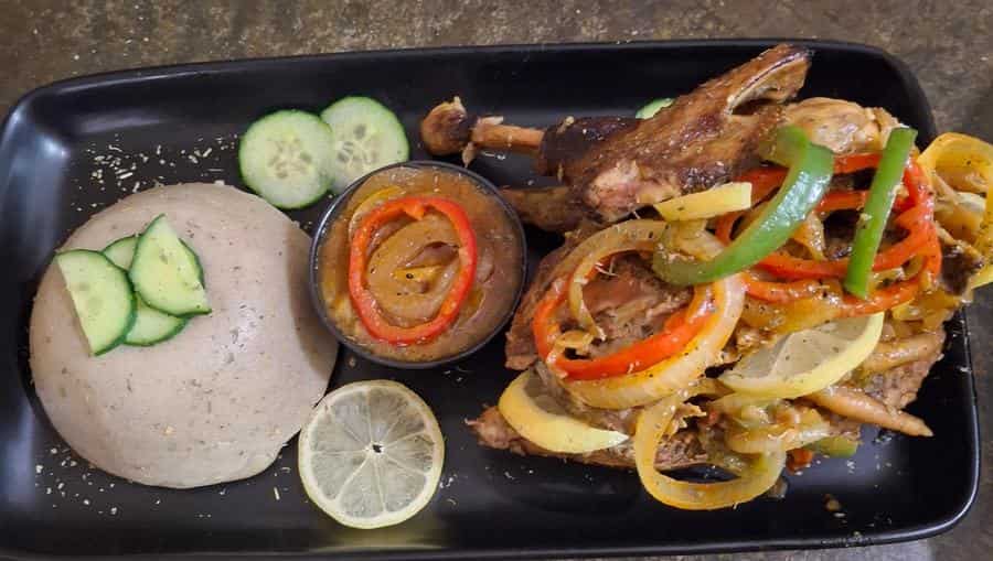 Family feast platter with pap, chicken and salads
