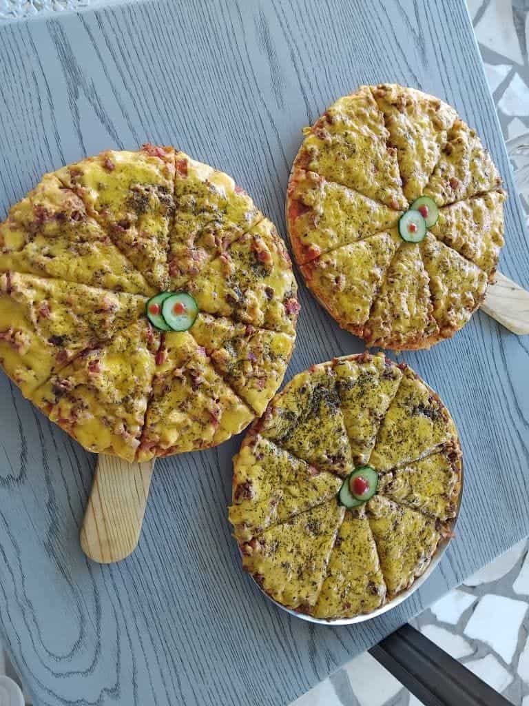 Three mini pancakes on a paddle board