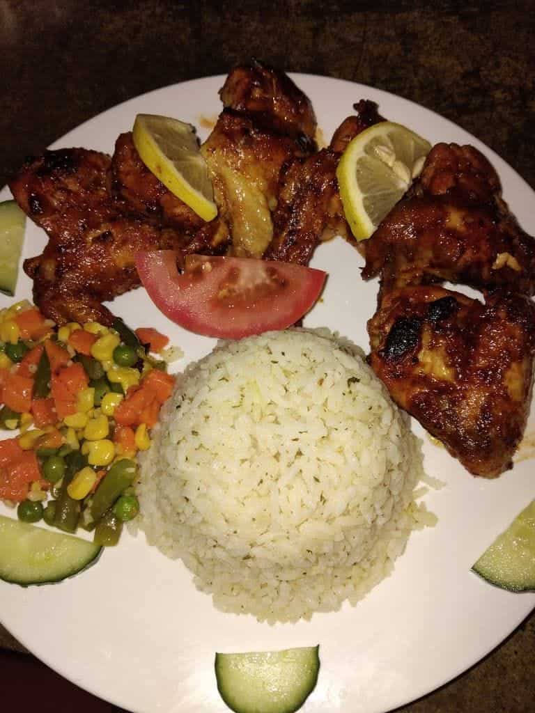 Chicken pieces with rice and greek salad
