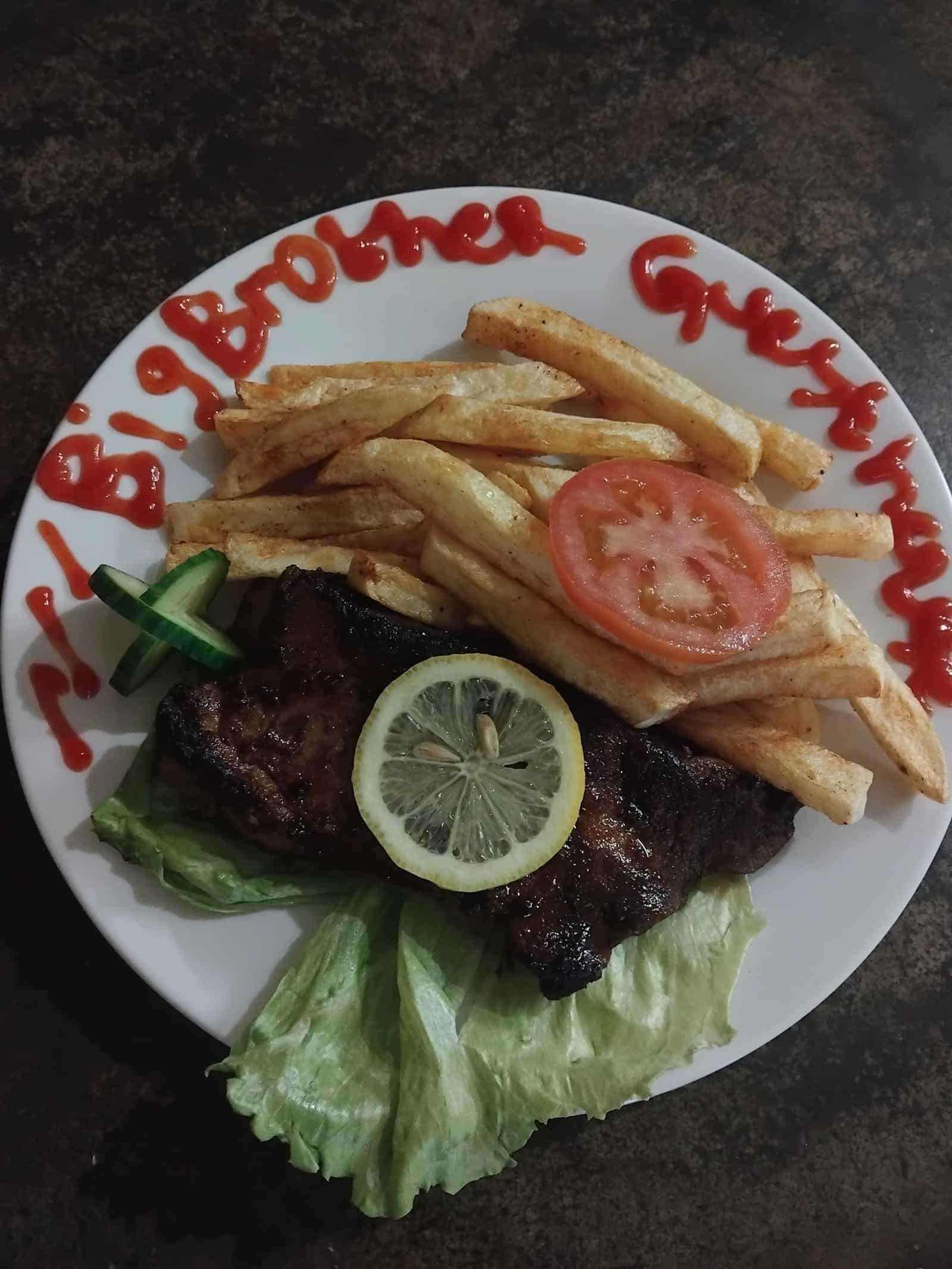 Steak, chips and salad on a Big Brothers plate