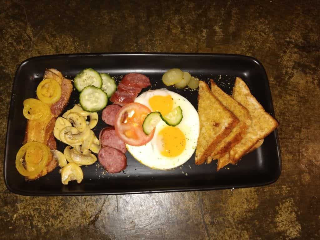 Breakfast tray with eggs, sausage and toast