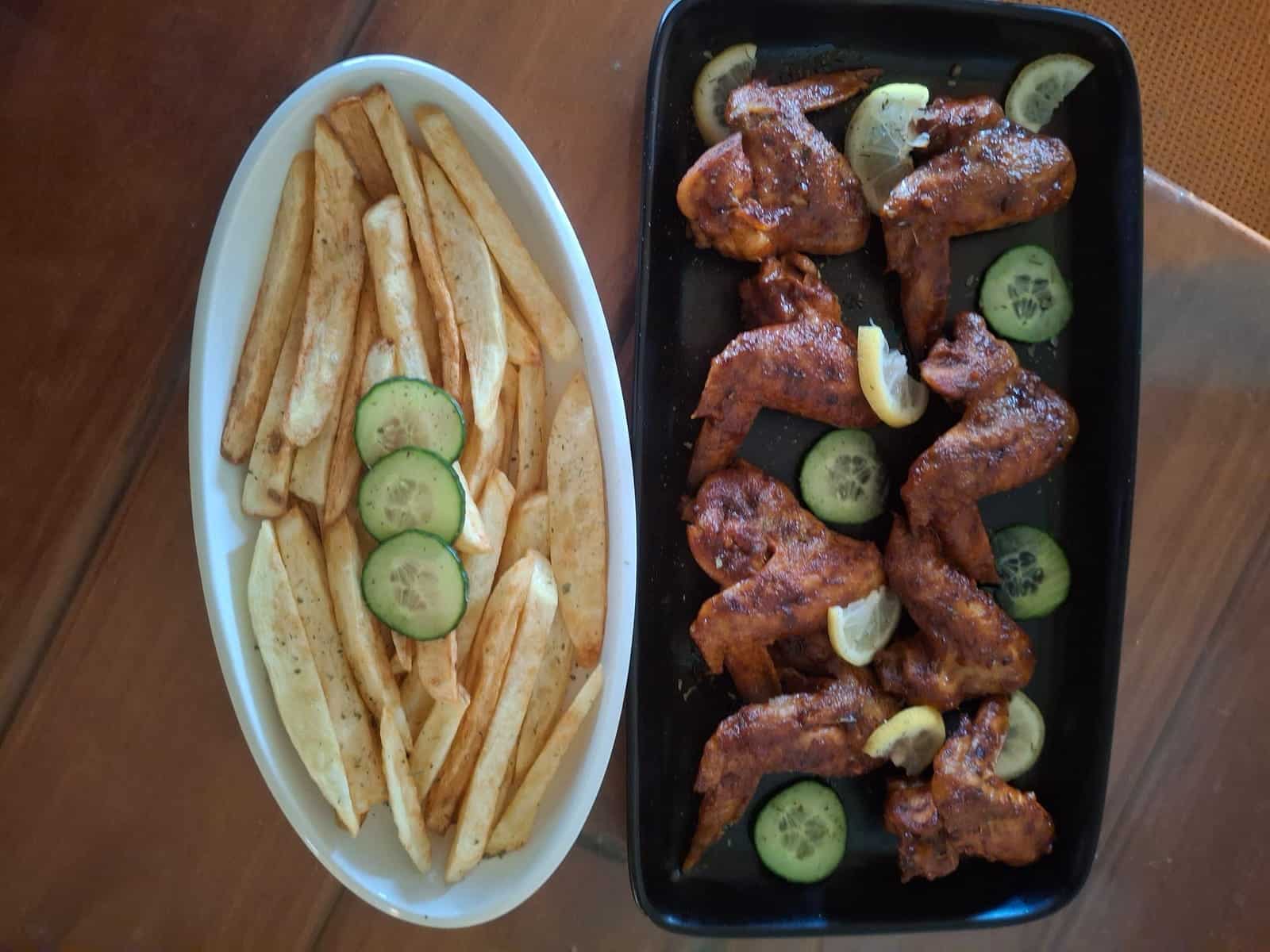 Ribs and chips on a black tray